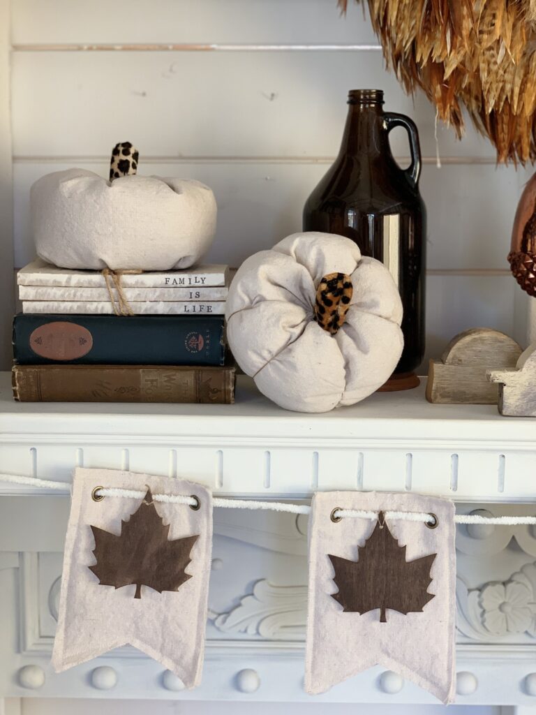 Easy fabric pumpkins DIY displayed in fall mantel decor.