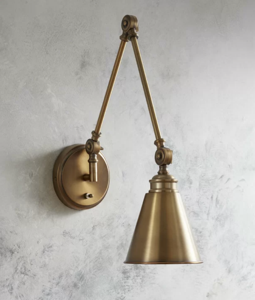 matte gold swing arm pendant light for beside the bed