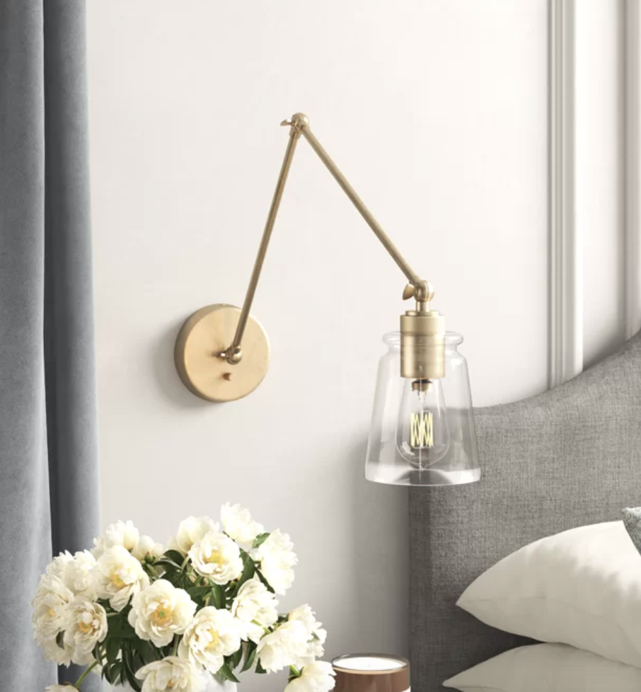 gold and glass wall light for beside bed