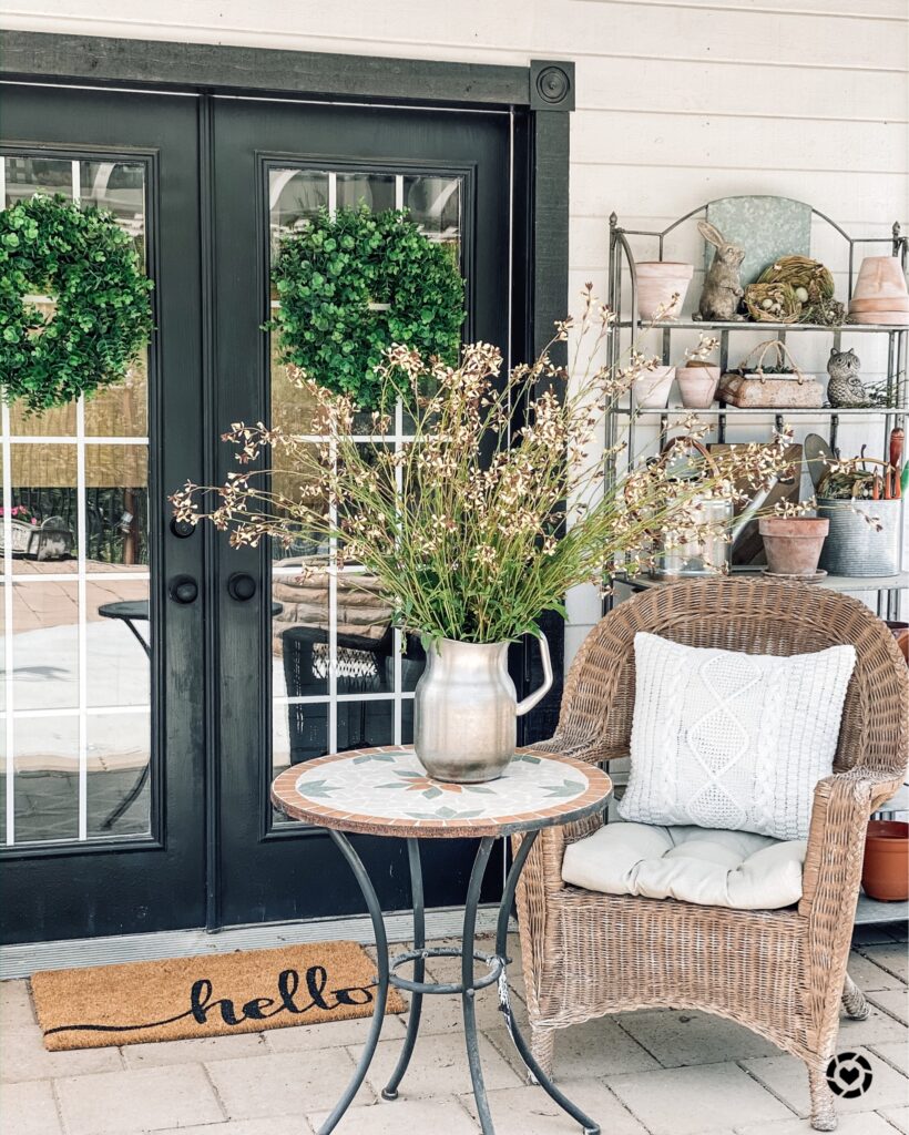 two boxwood wreaths from amazon on she shed doors with arugula flowers