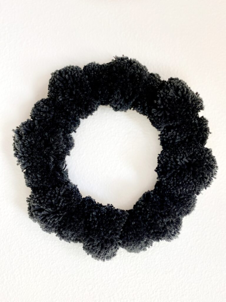 Black pom pom wreath