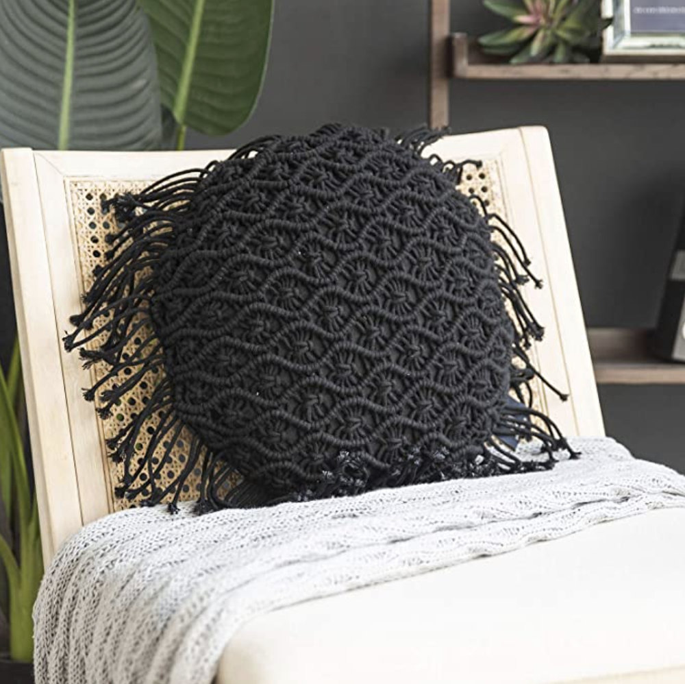round black macrame pillow cover on chair