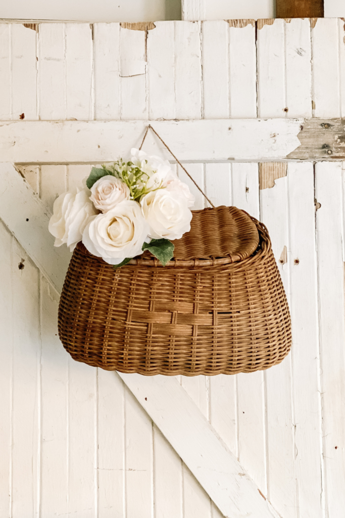 spring basket with flowers hanging on a door