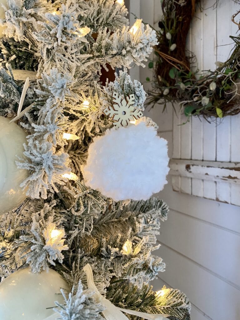 White DIY yarn ornament with a snowflake