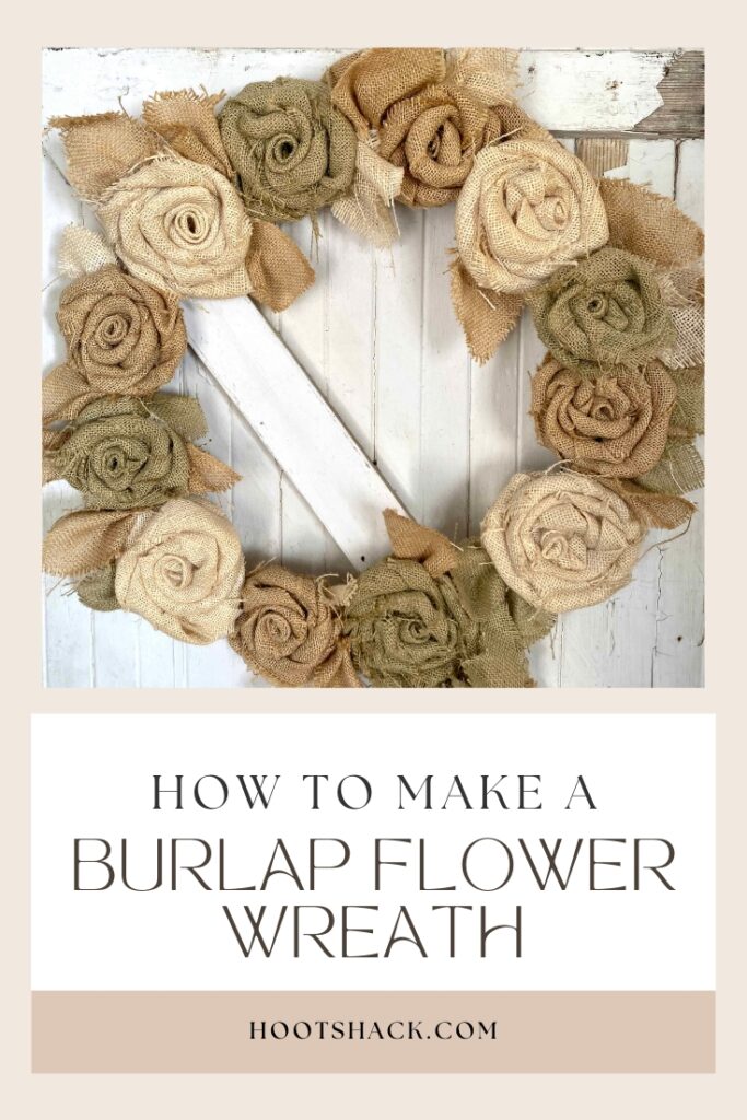 "How to make a burlap flower wreath".  A burlap flower wreath in tan, white and green.