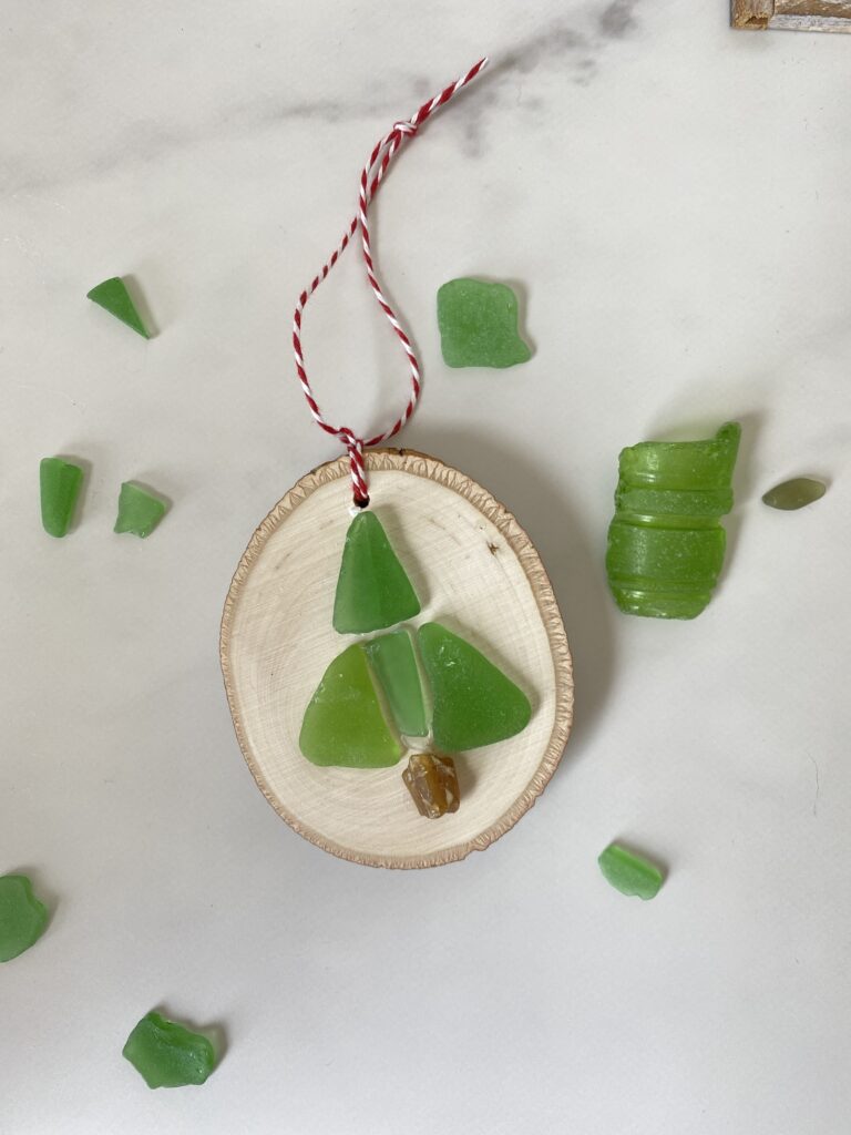 Sea glass Christmas Tree ornament on a wood slice