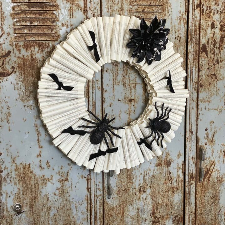 Book page wreath decorated for Halloween