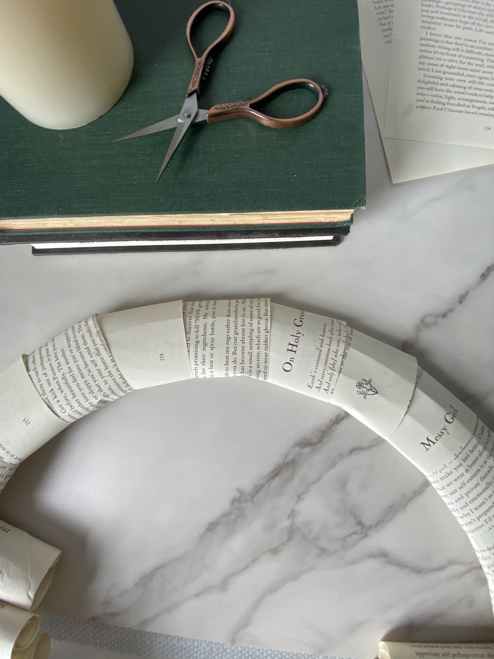 wrapping a wreath frame with book pages